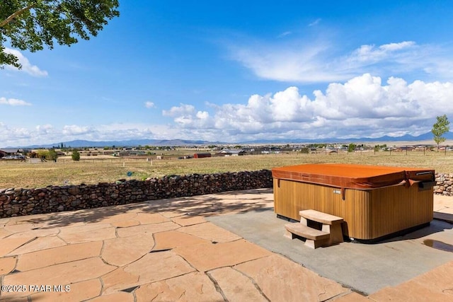 7889 E Dog Ranch Rd, Prescott Valley, AZ 86315 - view of patio / terrace featuring a hot tub, a mountain view, and a view of rural / pastoral area