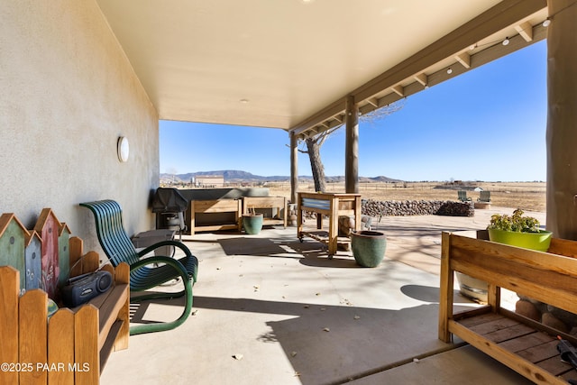 view of patio with a mountain view