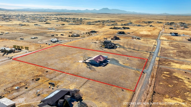 7889 E Dog Ranch Rd, Prescott Valley, AZ 86315 - aerial view of sparsely populated area with property boundaries highlighted, a desert landscape, and a mountain backdrop