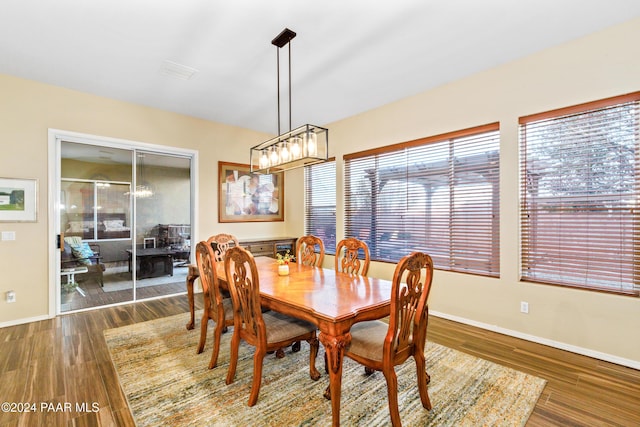 dining area with dark hardwood / wood-style floors