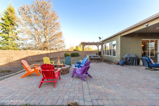 view of patio / terrace featuring area for grilling, a pergola, and an outdoor fire pit