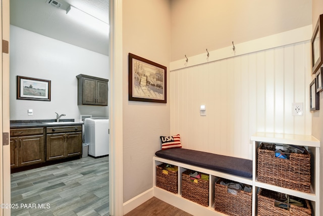892 Canyon Breeze Ct, Prescott, AZ 86303 - mudroom with a sink, light wood-style flooring, washer / clothes dryer, baseboards, and visible vents
