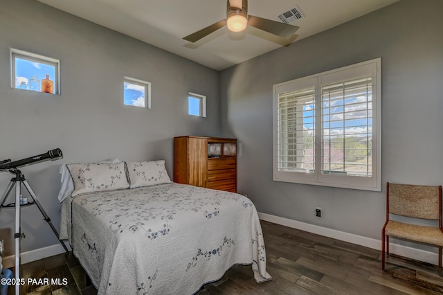 892 Canyon Breeze Ct, Prescott, AZ 86303 - bedroom with baseboards, multiple windows, and wood finished floors