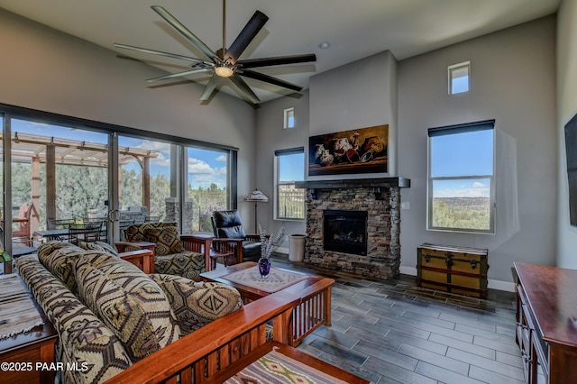 892 Canyon Breeze Ct, Prescott, AZ 86303 - living area with a high ceiling, a wealth of natural light, ceiling fan, and a fireplace