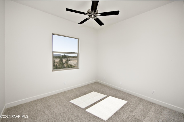 carpeted empty room with ceiling fan