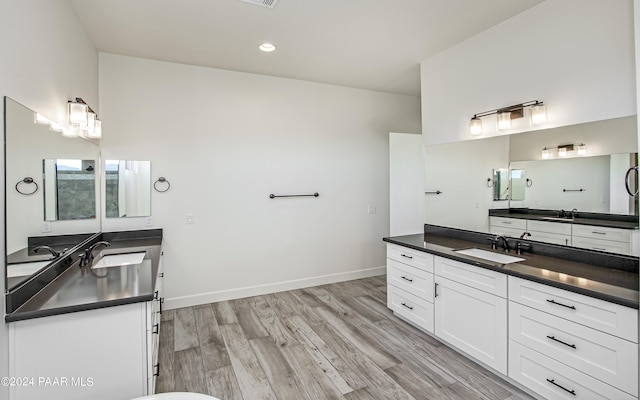 bathroom featuring wood-type flooring and vanity