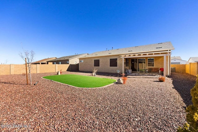 rear view of house with a patio