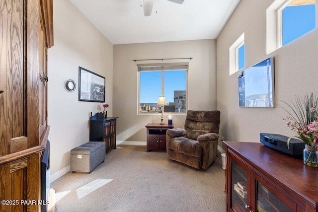 sitting room featuring ceiling fan and light carpet