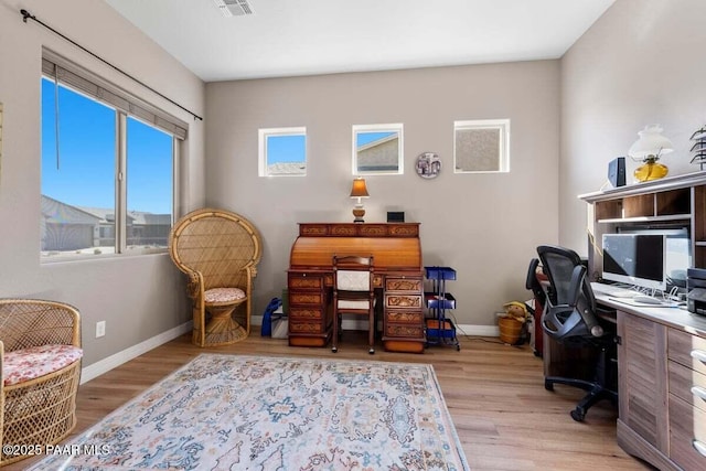 office area with light hardwood / wood-style flooring