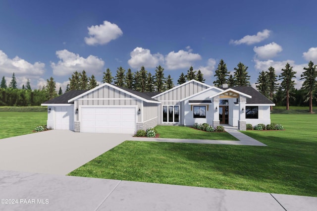 view of front of property featuring a front yard and a garage