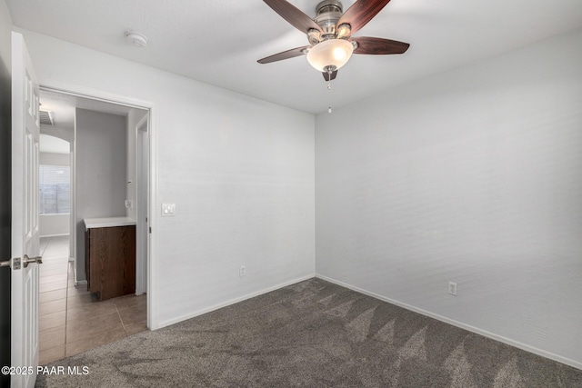 3713 W Nancy Ln, Phoenix, AZ 85041 - unfurnished room featuring carpet flooring, a ceiling fan, a smoke detector, and tile patterned flooring