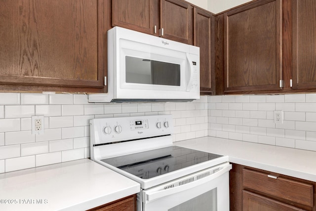 3713 W Nancy Ln, Phoenix, AZ 85041 - kitchen featuring white appliances, light countertops, tasteful backsplash, and dark brown cabinetry