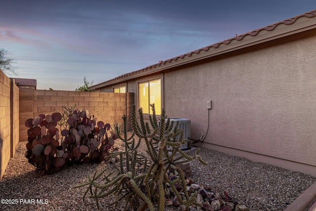 3713 W Nancy Ln, Phoenix, AZ 85041 - property exterior at dusk with a cooling unit and stucco siding