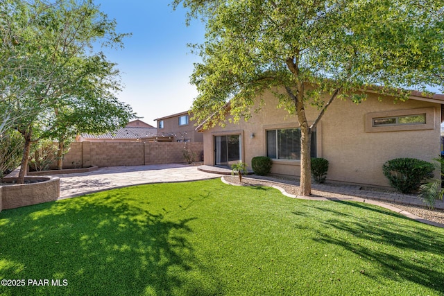 3713 W Nancy Ln, Phoenix, AZ 85041 - back of property featuring stucco siding and a patio area