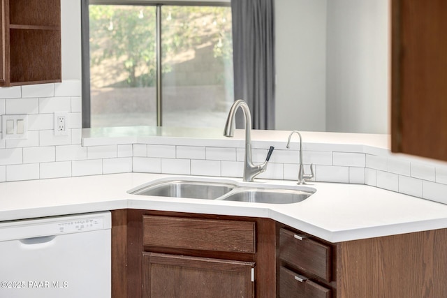 3713 W Nancy Ln, Phoenix, AZ 85041 - kitchen with white dishwasher, light countertops, and tasteful backsplash
