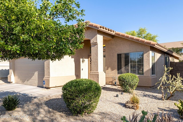 3713 W Nancy Ln, Phoenix, AZ 85041 - view of front of property featuring a garage, stucco siding, concrete driveway, and a tiled roof