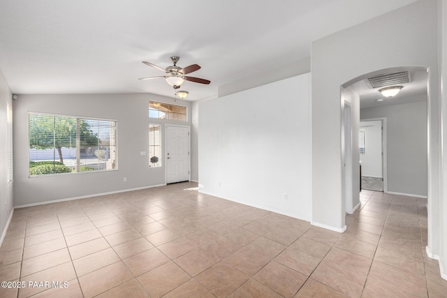 3713 W Nancy Ln, Phoenix, AZ 85041 - unfurnished room featuring light tile patterned floors, a ceiling fan, and arched walkways