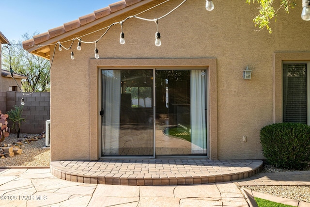 3713 W Nancy Ln, Phoenix, AZ 85041 - view of exterior entry featuring stucco siding and a patio area