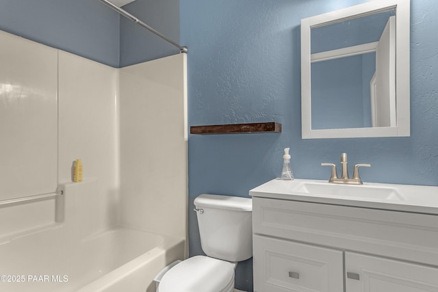full bath with washtub / shower combination, a textured wall, toilet, and vanity
