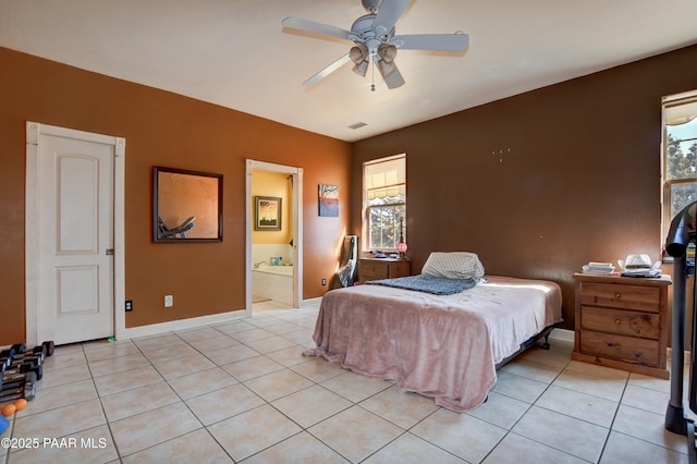 bedroom with light tile patterned floors, a ceiling fan, visible vents, and baseboards