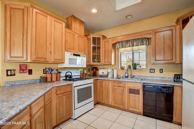 kitchen featuring white appliances, light tile patterned floors, glass insert cabinets, a sink, and recessed lighting