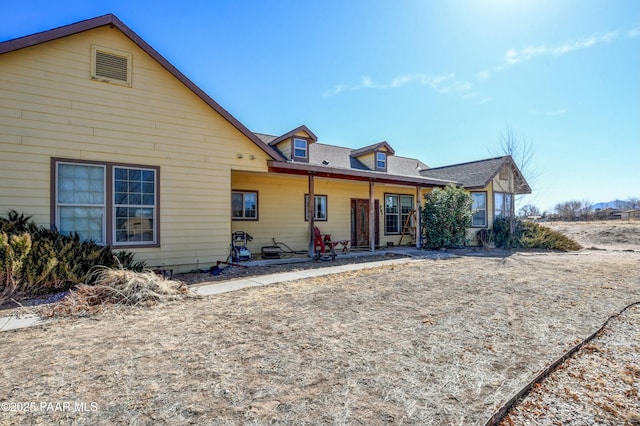 rear view of house featuring a patio area