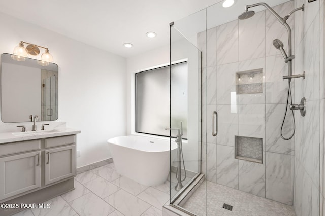 1242 N Oxbow Dr, Dewey-Humboldt, AZ 86327 - full bath with a stall shower, marble finish flooring, a freestanding tub, vanity, and recessed lighting