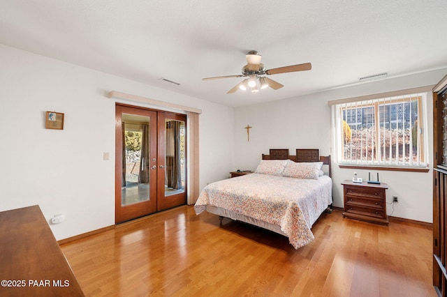 bedroom featuring access to exterior, light hardwood / wood-style floors, french doors, and ceiling fan