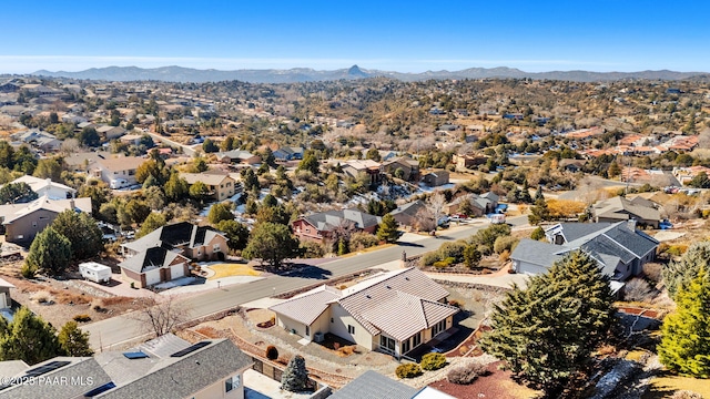 birds eye view of property with a mountain view