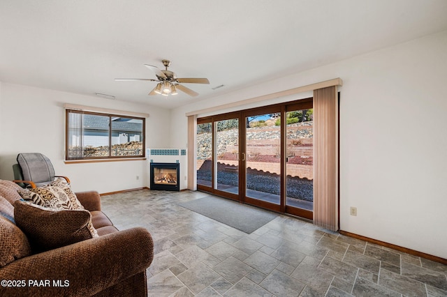 living room with french doors and ceiling fan