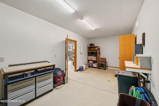 miscellaneous room with a textured ceiling