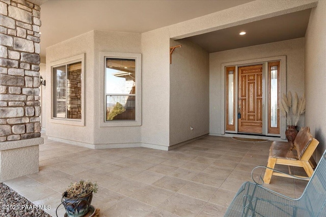 doorway to property featuring a patio area