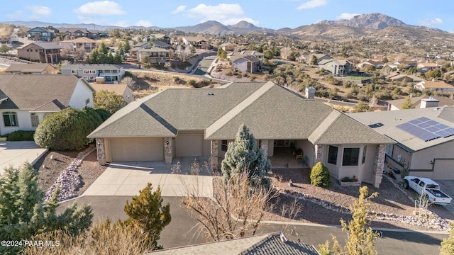 birds eye view of property featuring a mountain view