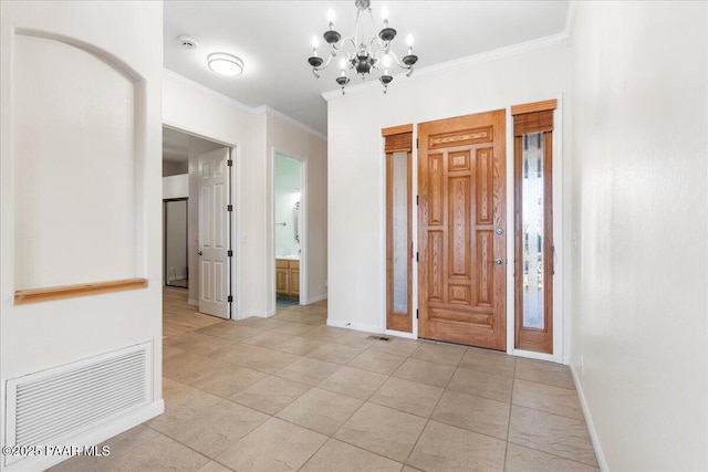 foyer featuring light tile patterned floors, crown molding, and a notable chandelier