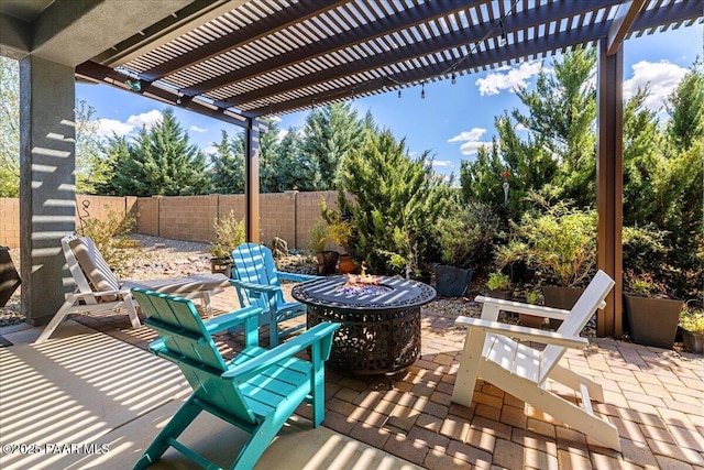7123 E Roque Ln, Prescott Valley, AZ 86315 - view of patio featuring a fire pit, a fenced backyard, and a pergola