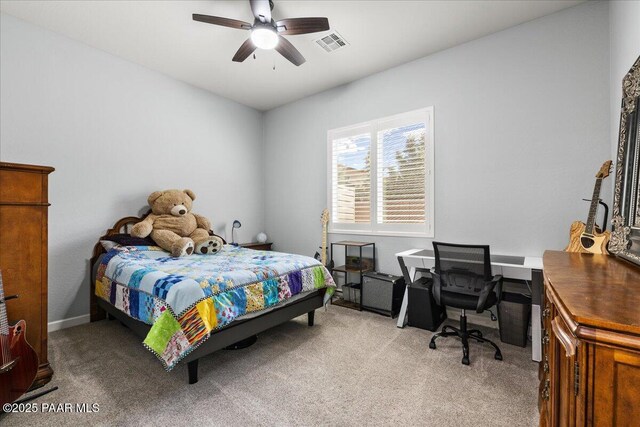 7123 E Roque Ln, Prescott Valley, AZ 86315 - bedroom featuring light colored carpet, a desk, and a ceiling fan