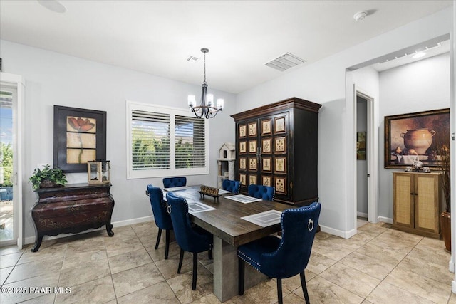 7123 E Roque Ln, Prescott Valley, AZ 86315 - dining area with a chandelier and baseboards