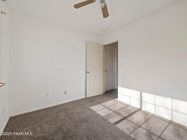 empty room with carpet and ceiling fan