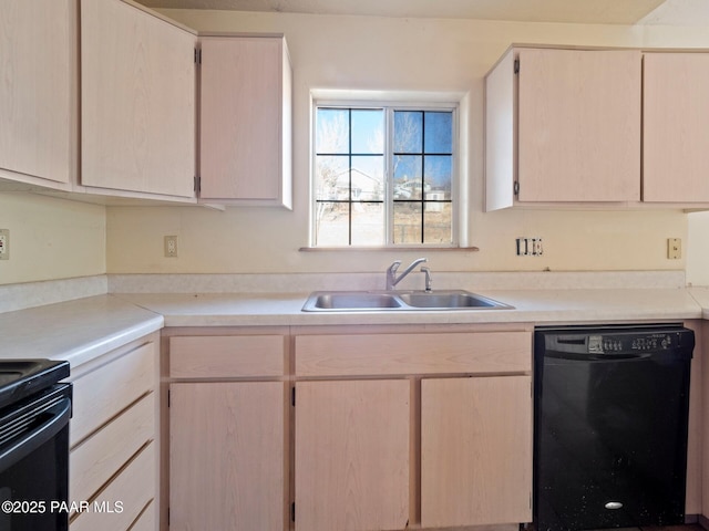 kitchen with sink, light brown cabinets, and black appliances