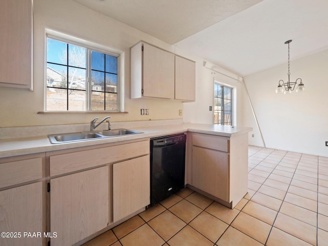 kitchen featuring decorative light fixtures, dishwasher, kitchen peninsula, sink, and an inviting chandelier