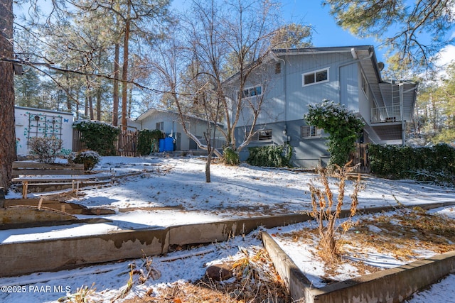 view of snow covered house