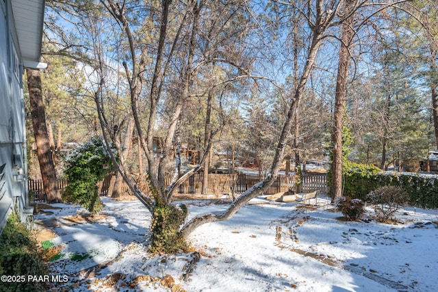 view of yard layered in snow