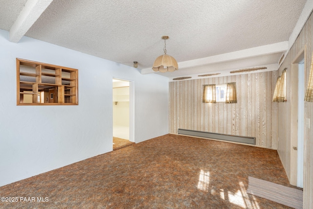 empty room with a baseboard radiator and a textured ceiling