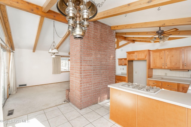 kitchen featuring white gas cooktop, lofted ceiling with beams, light carpet, ceiling fan, and decorative backsplash