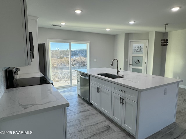 kitchen featuring range, white cabinets, a sink, and dishwasher