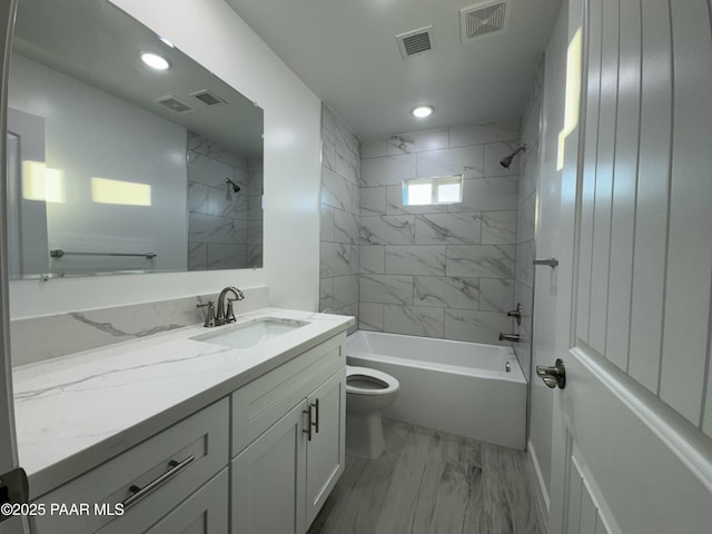 bathroom with visible vents, toilet, and tub / shower combination