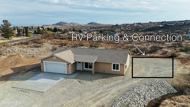 drone / aerial view featuring a mountain view