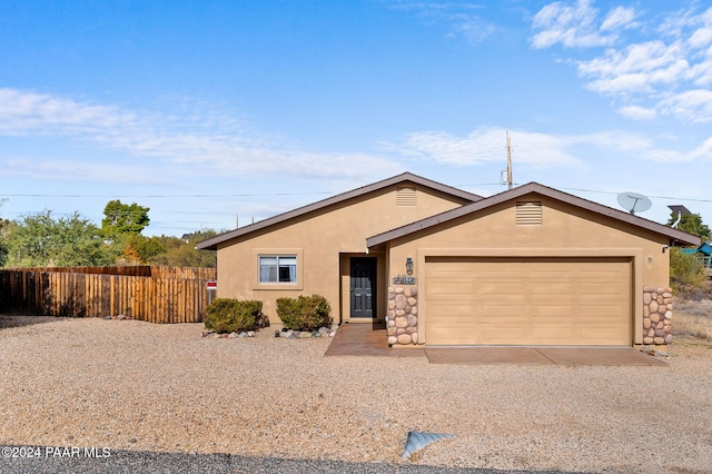 single story home featuring a garage