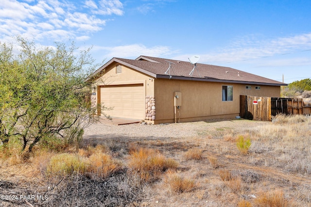 view of home's exterior with a garage