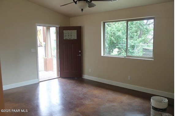 foyer featuring ceiling fan and vaulted ceiling